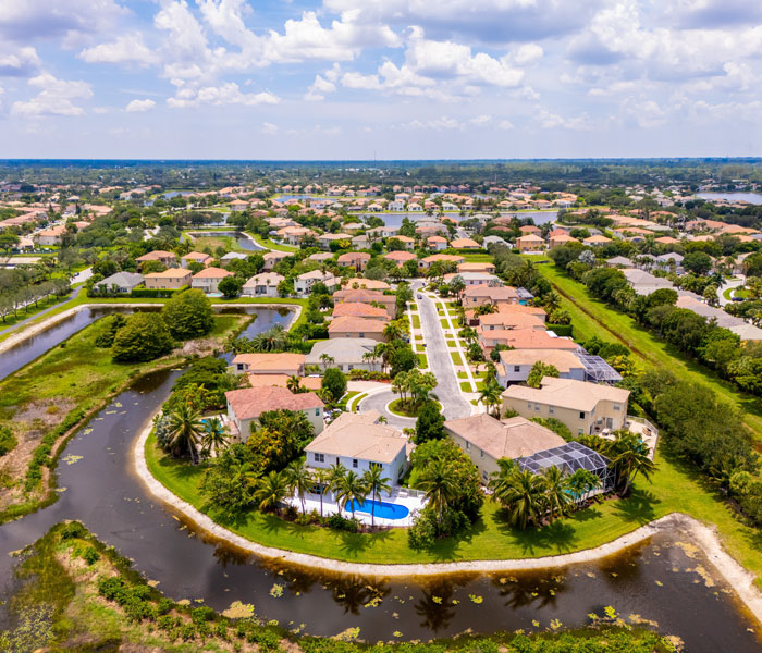 Aerial view of residential neighborhoods, lakes and palm trees in Wellington, Florida
