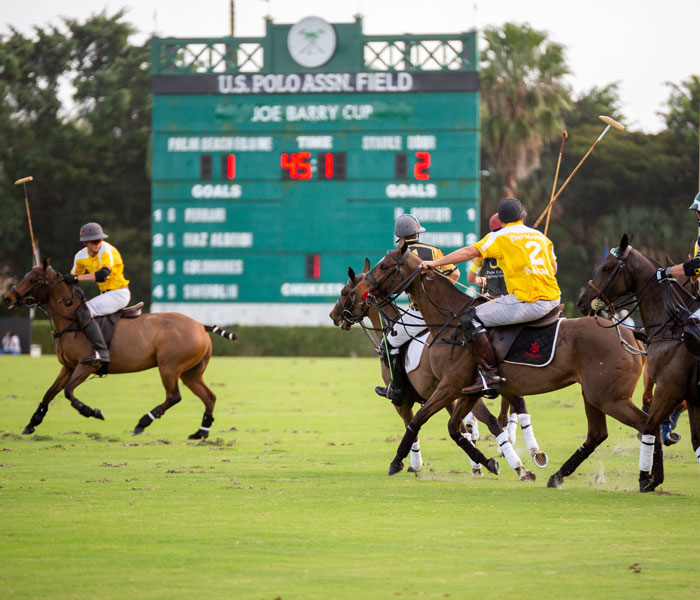 Polo players competing on horseback at the U.S. Polo Association Field in Wellington, Florida